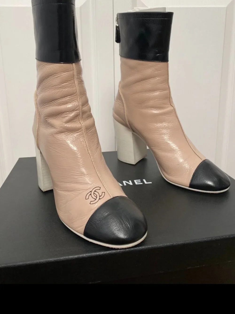 CHANEL Two-Toned Leather Cap-Toe Block Heel Ankle Boots in Beige & Black